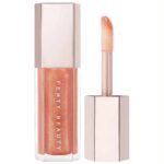 FENTY BEAUTY-ملمع شفاه عالمي من غلوس بومب(CHAMP STAMP FANTASY) 9ml